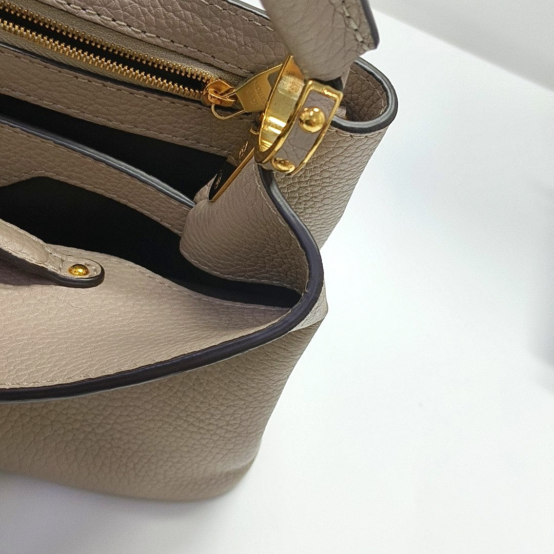 Authenticated pre-owned  CAPUCINES BB Calfskin Grey - Shoulder Bag at Looply
