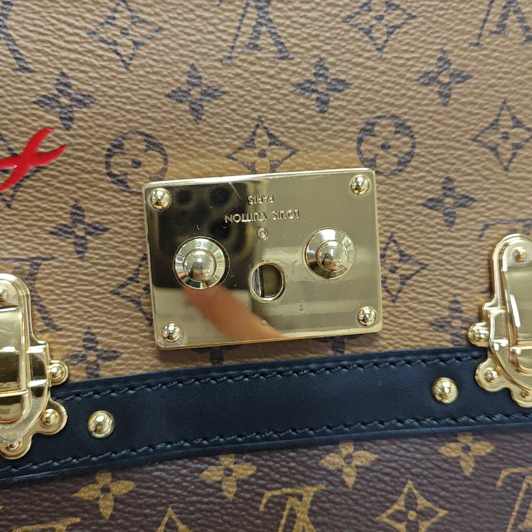 TRUNK Monogram Coated Canvas Brown
