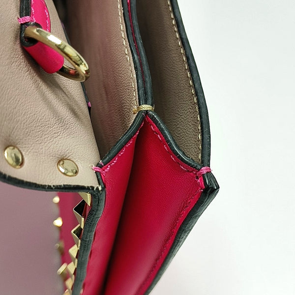 Authenticated pre-owned  Rockstud Lambskin Pink - Clutch at Looply