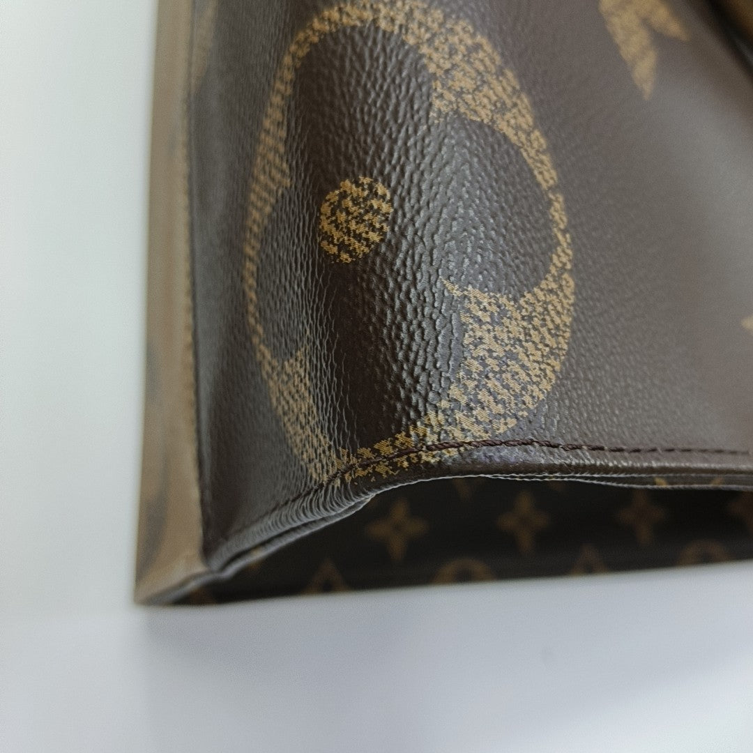 ONTHEGO MM Monogram Coated Canvas Brown