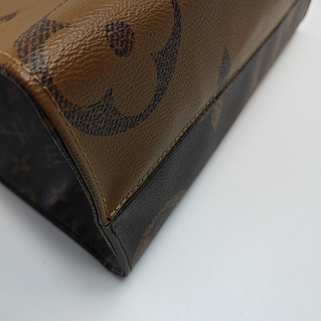ONTHEGO MM Monogram Coated Canvas Brown