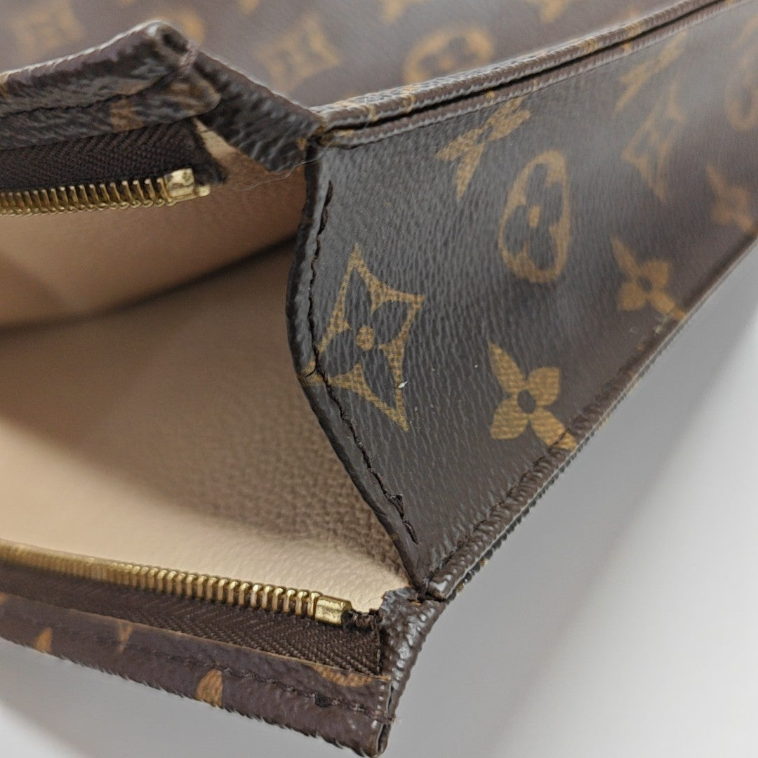 TOILET POCKET 26 Monogram Coated Canvas Brown