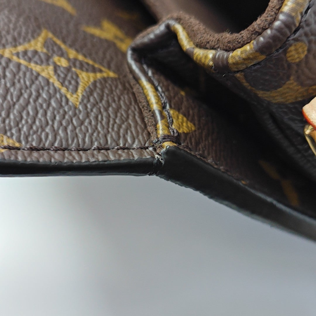 MÉTIS EAST WEST Monogram Coated Canvas Brown