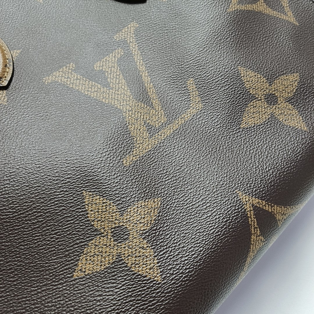 ONTHEGO MM Monogram Coated Canvas Brown