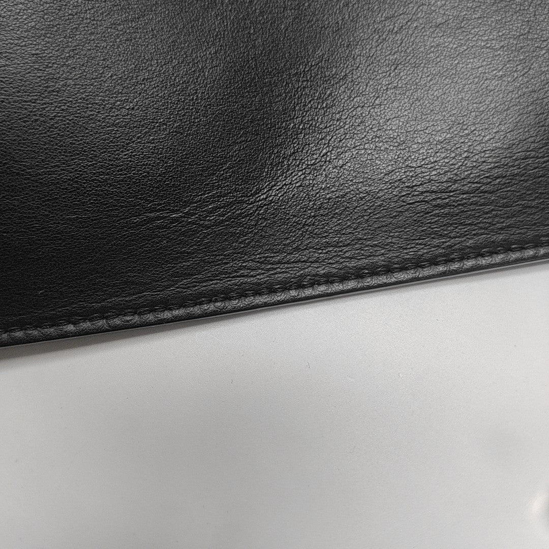 Authenticated pre-owned  Monster Calfskin Black - Clutch at Looply