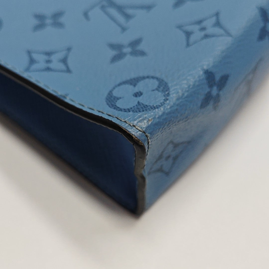 Pochette Voyag MM Monogram Coated Canvas Blue