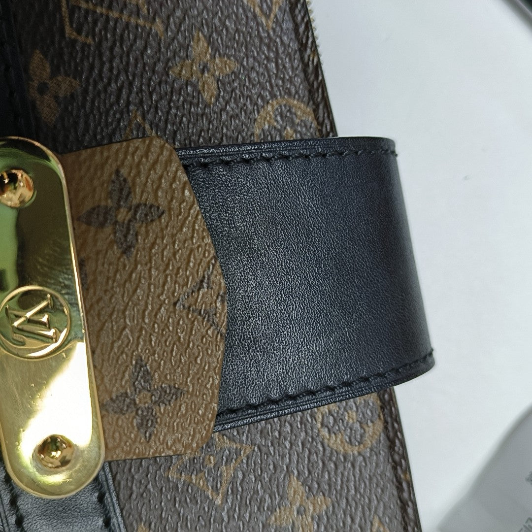 TRUNK Monogram Coated Canvas Brown