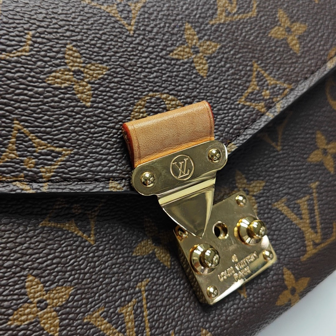 MÉTIS EAST WEST Monogram Coated Canvas Brown