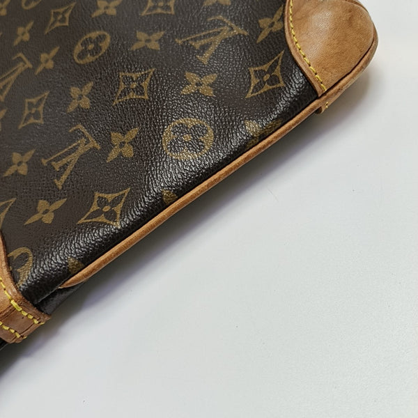 COUSSIN GM Monogram Coated Canvas Brown