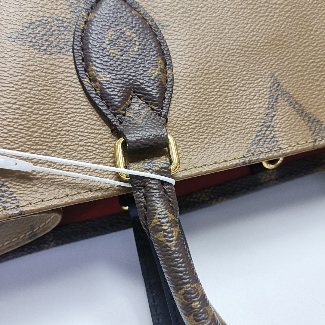 ONTHEGO MM Monogram Coated Canvas Brown