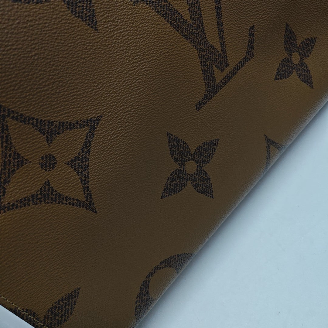ONTHEGO GM Monogram Coated Canvas Brown