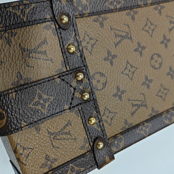 TRUNK Monogram Coated Canvas Brown