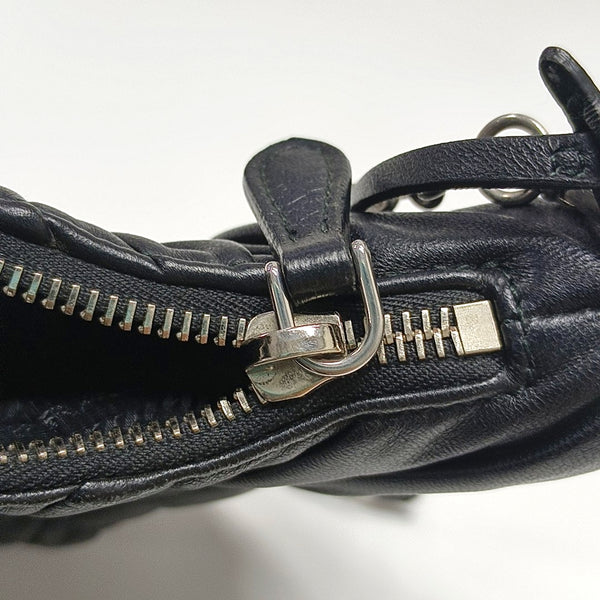 Authenticated pre-owned  Re-Edition2005 Quilted Lambskin Black - Top Handle Bag at Looply
