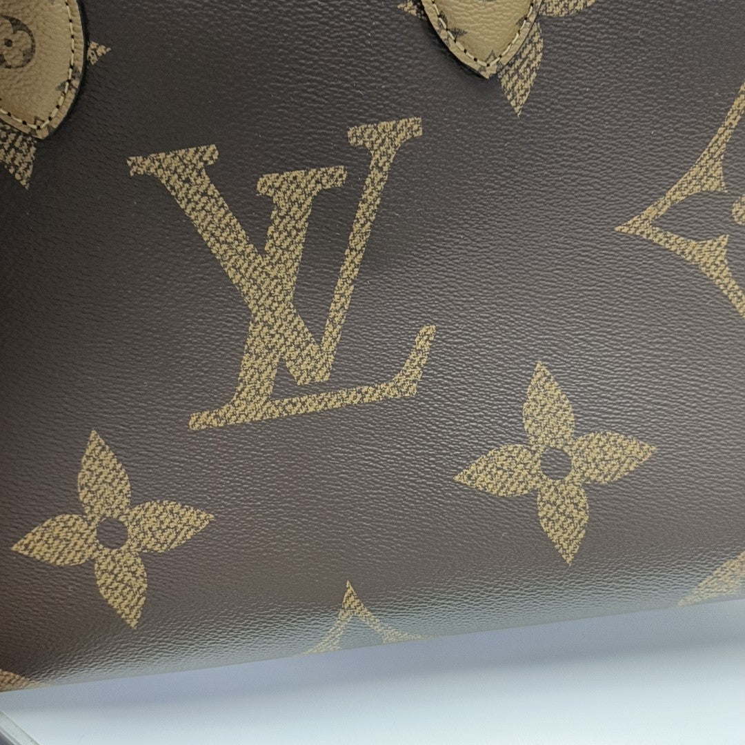 ONTHEGO MM Monogram Coated Canvas Brown