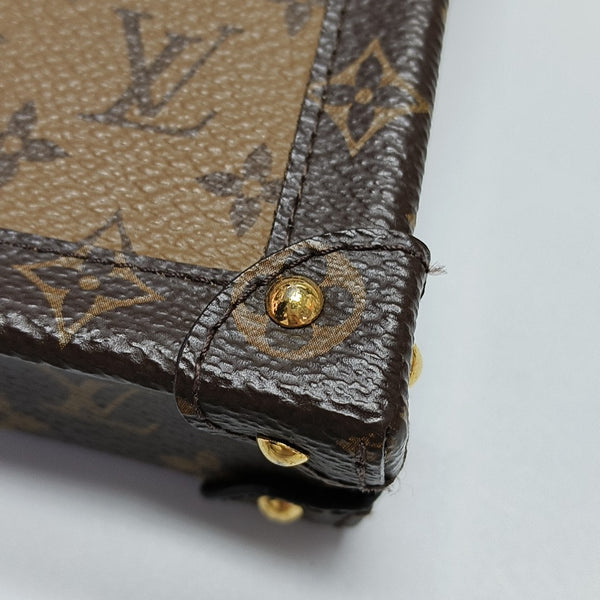 TRUNK Monogram Coated Canvas Brown
