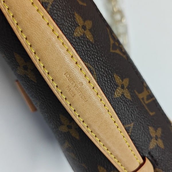 MÉTIS EAST WEST Monogram Coated Canvas Brown