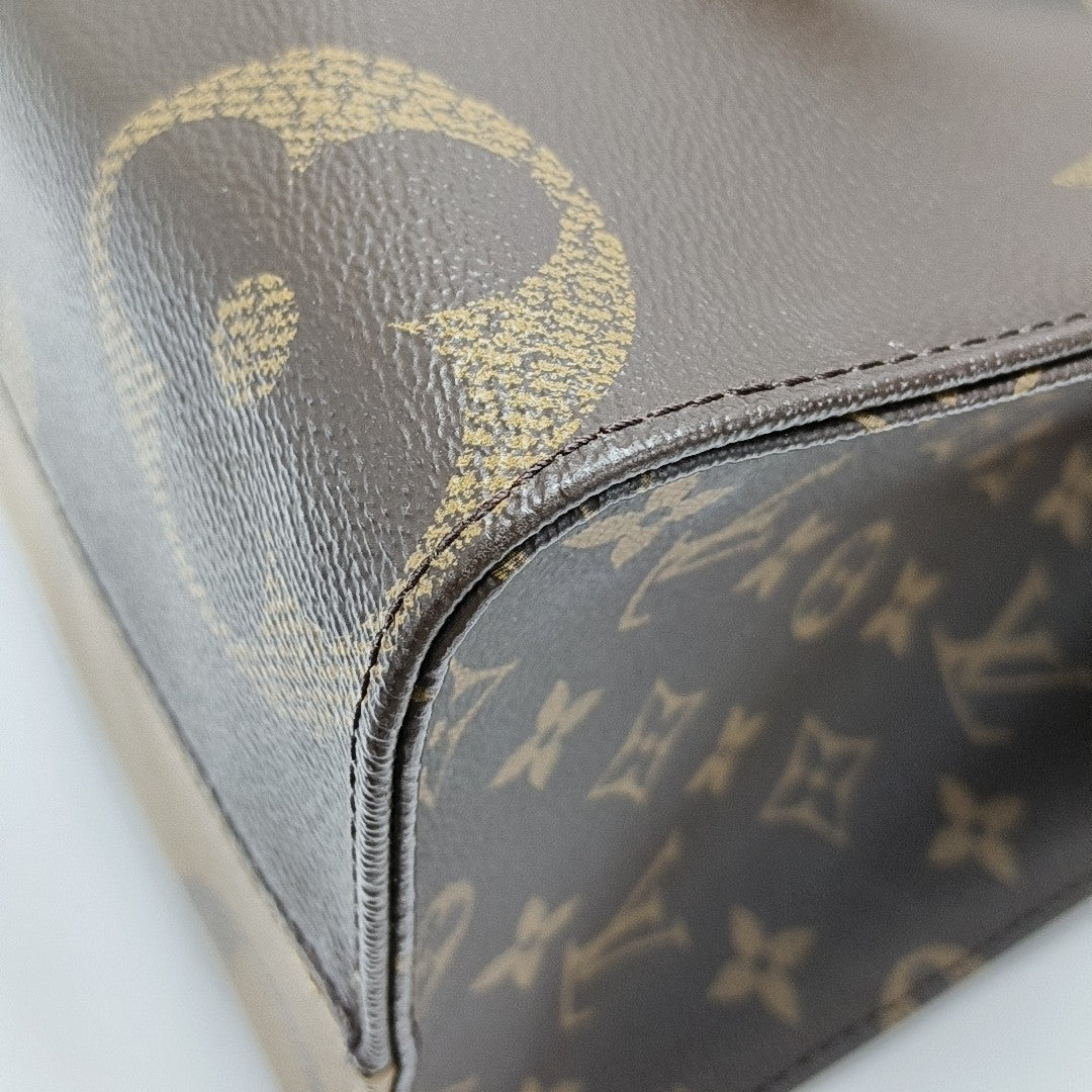 ONTHEGO MM Monogram Coated Canvas Brown