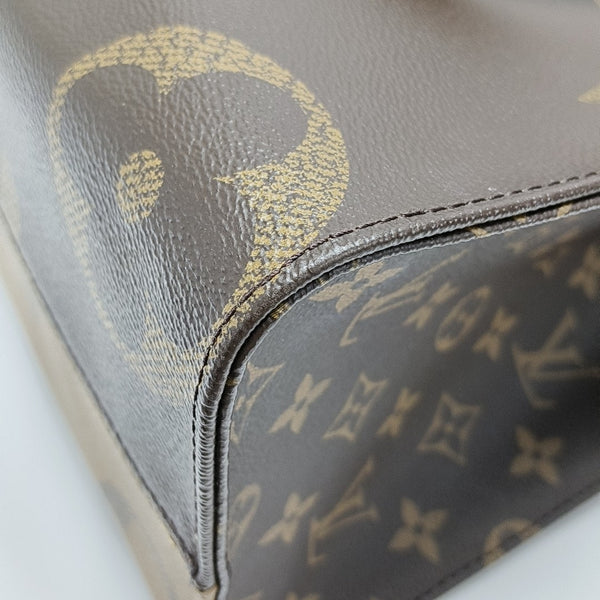 ONTHEGO MM Monogram Coated Canvas Brown