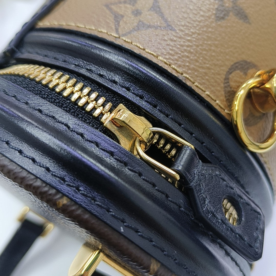 CANNES PM Monogram Coated Canvas Brown
