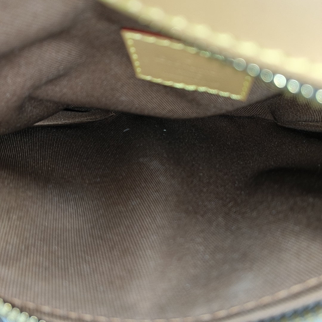 SAUMUR PM Monogram Coated Canvas Brown