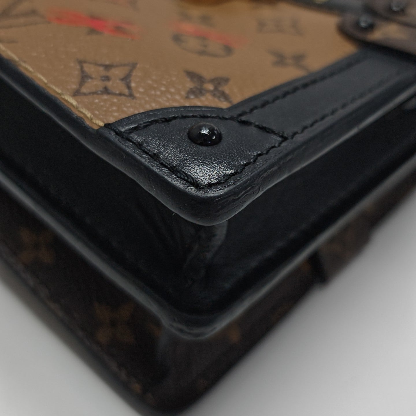 TRUNK Monogram Coated Canvas Brown
