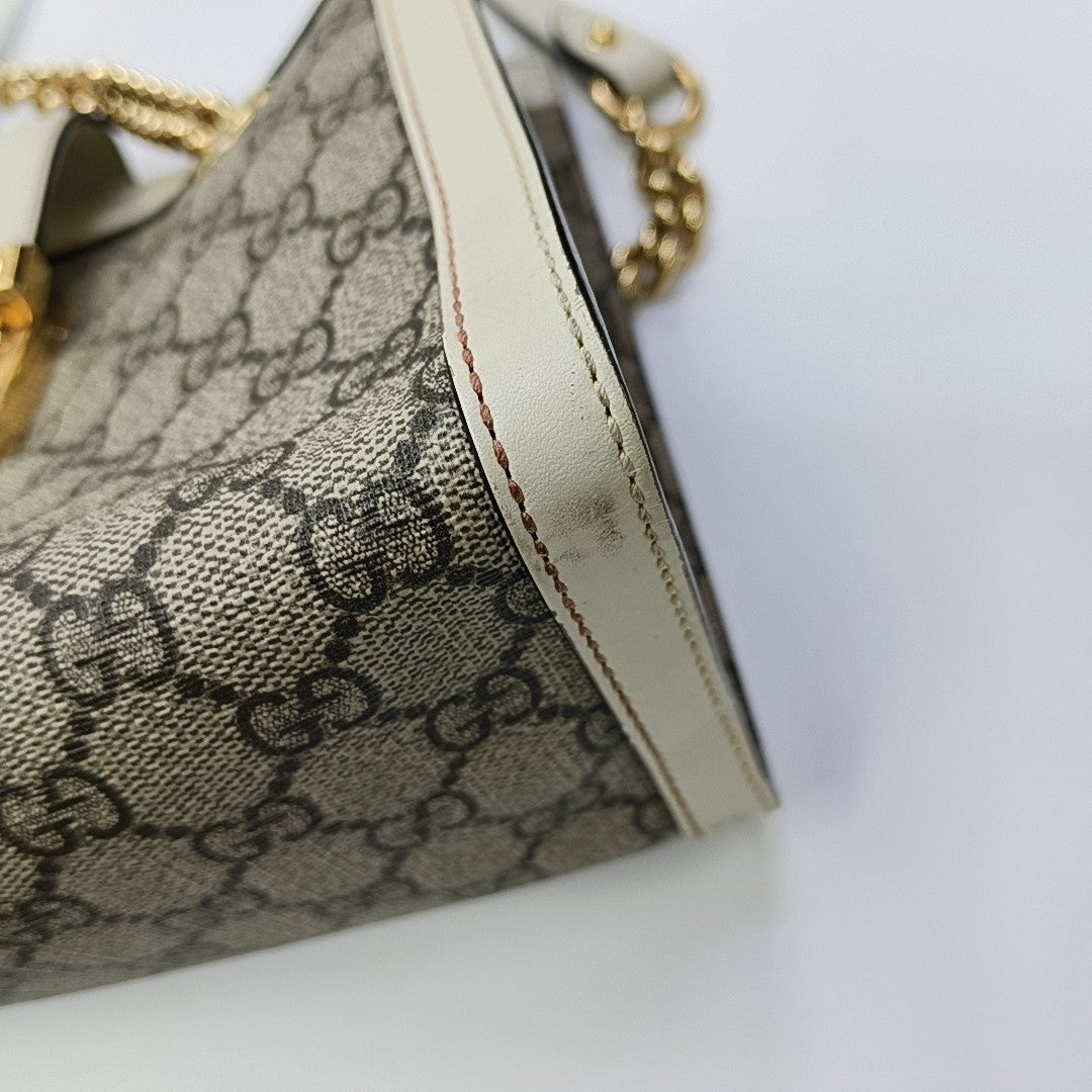 Padlock Small Monogram Coated Canvas Beige
