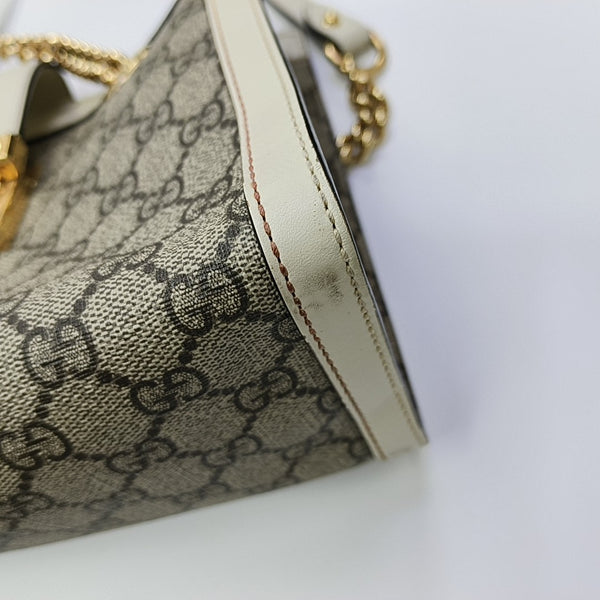 Padlock Small Monogram Coated Canvas Beige