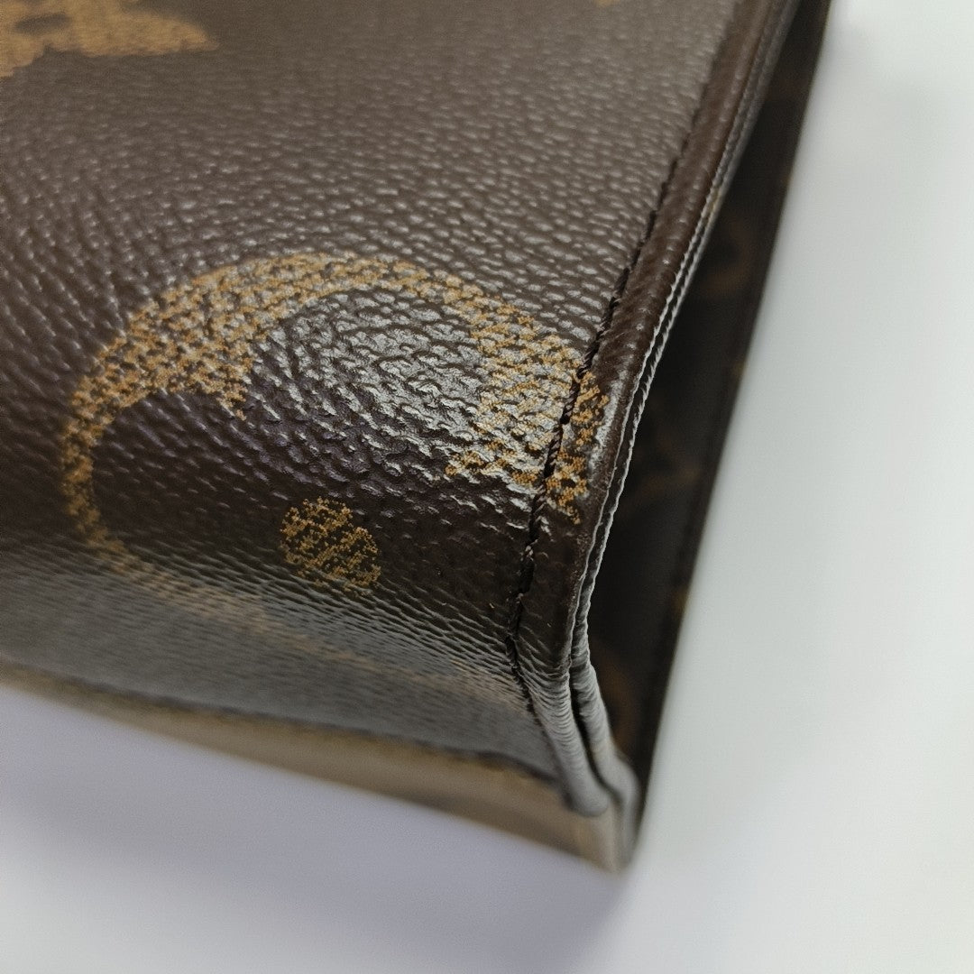 ONTHEGO PM Monogram Coated Canvas Brown
