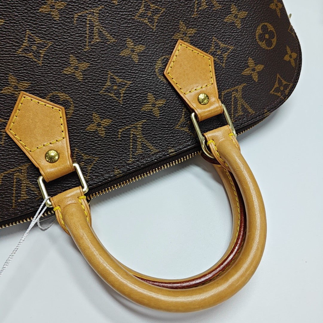 ALMA PM Monogram Coated Canvas Brown