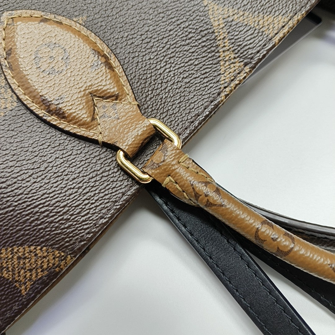 ONTHEGO MM Monogram Coated Canvas Brown
