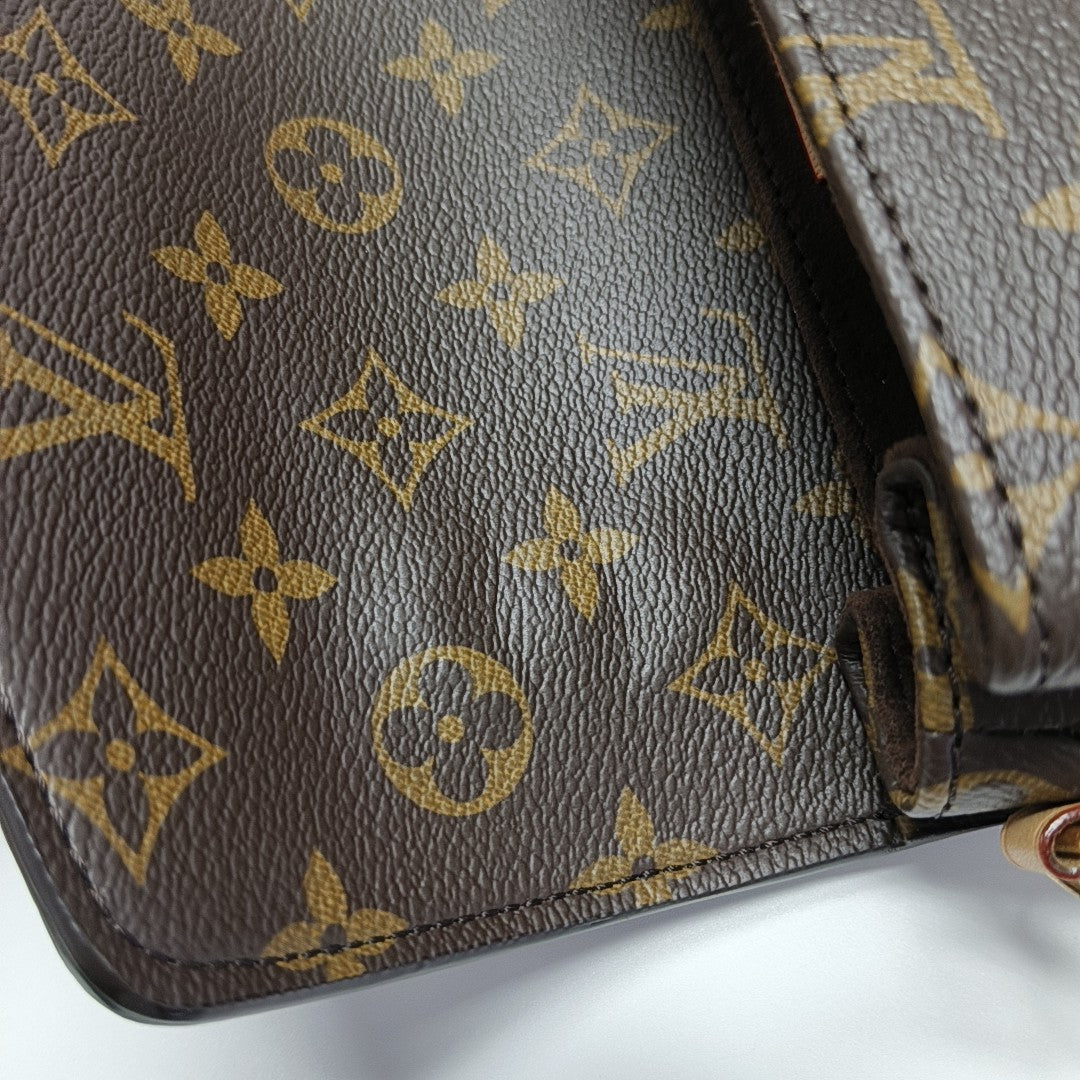 MÉTIS EAST WEST Monogram Coated Canvas Brown