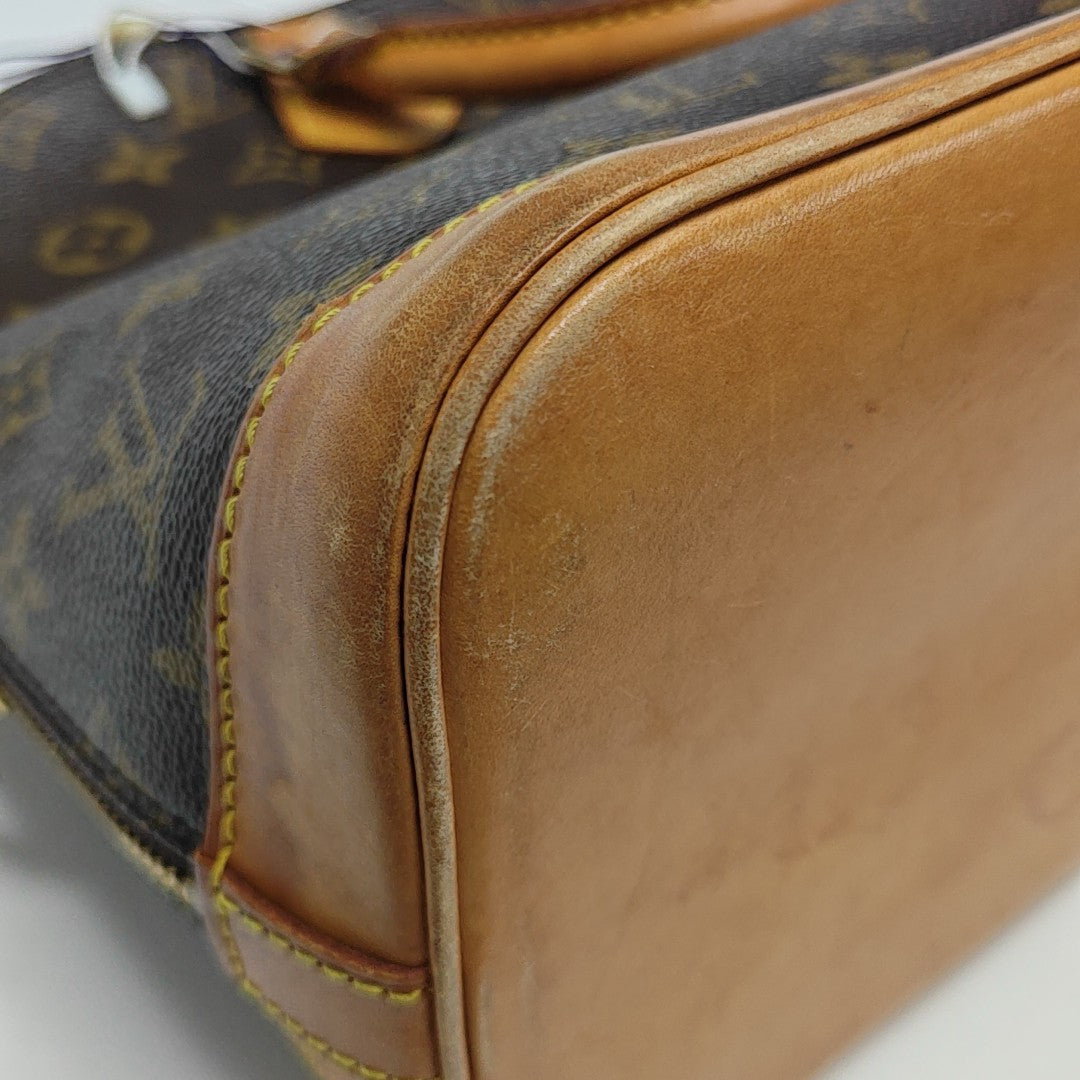 ALMA PM Monogram Coated Canvas Brown