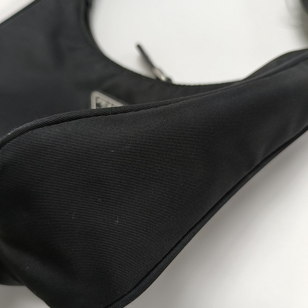Authenticated pre-owned  Re-Edition2000 Mini Nylon Black - Top Handle Bag at Looply