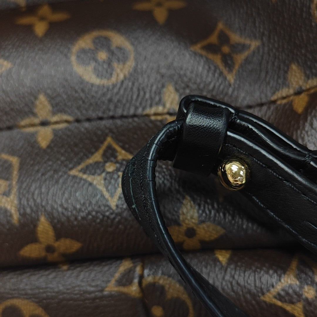 Monogram Coated Canvas Backpack Brown
