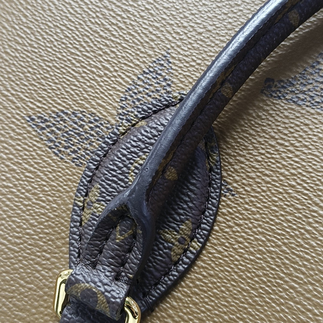 ONTHEGO MM Monogram Coated Canvas Brown
