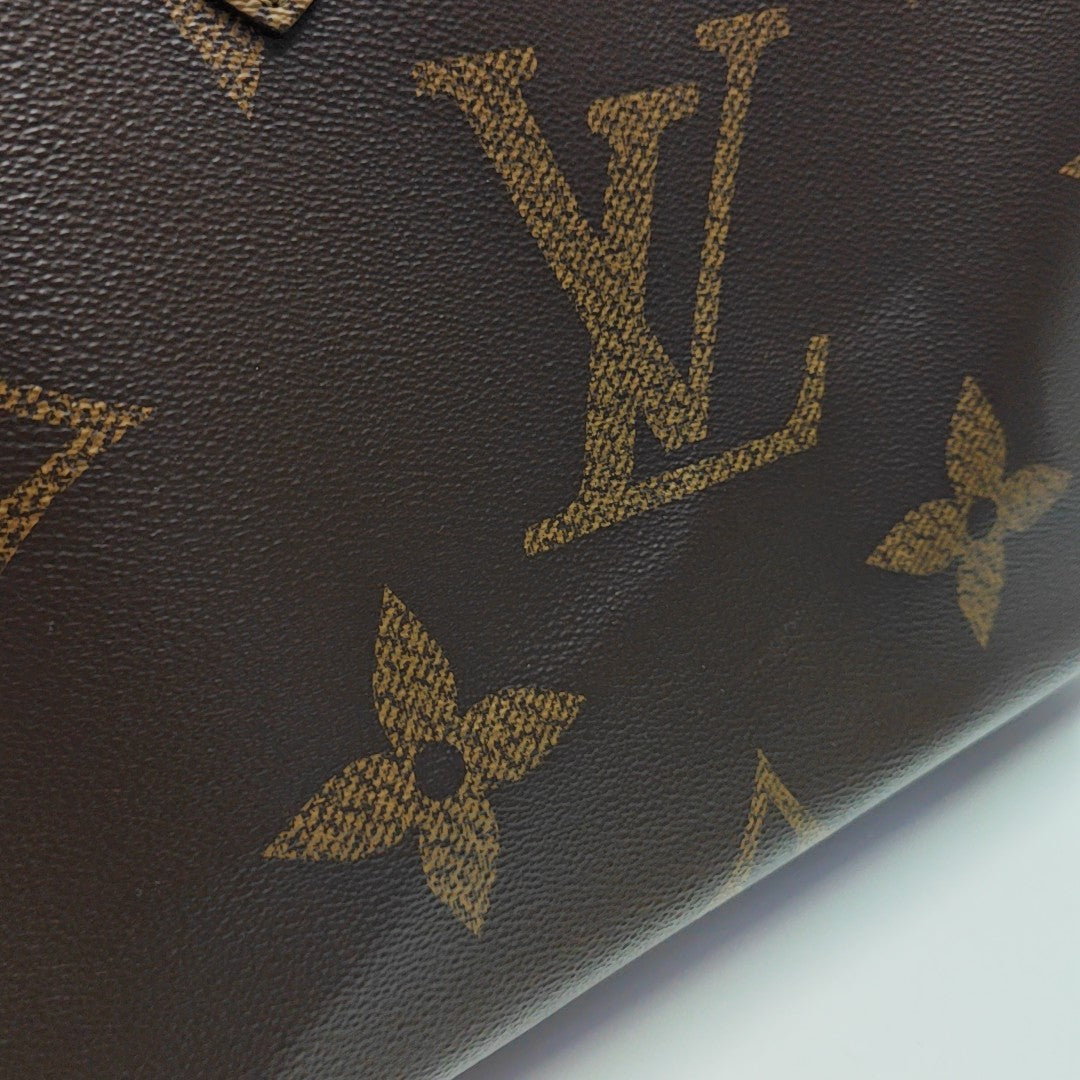 ONTHEGO MM Monogram Coated Canvas Brown