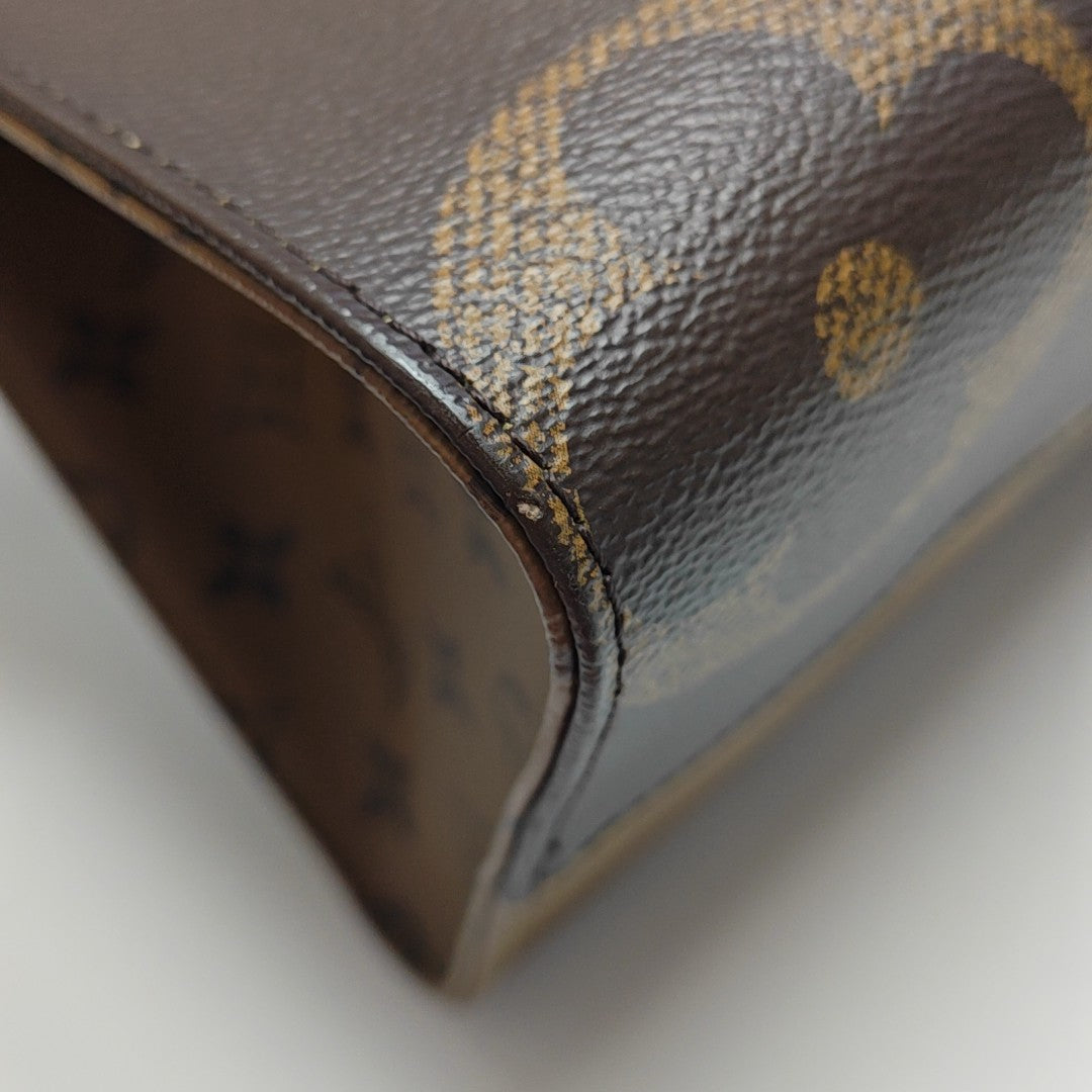 ONTHEGO MM Monogram Coated Canvas Brown