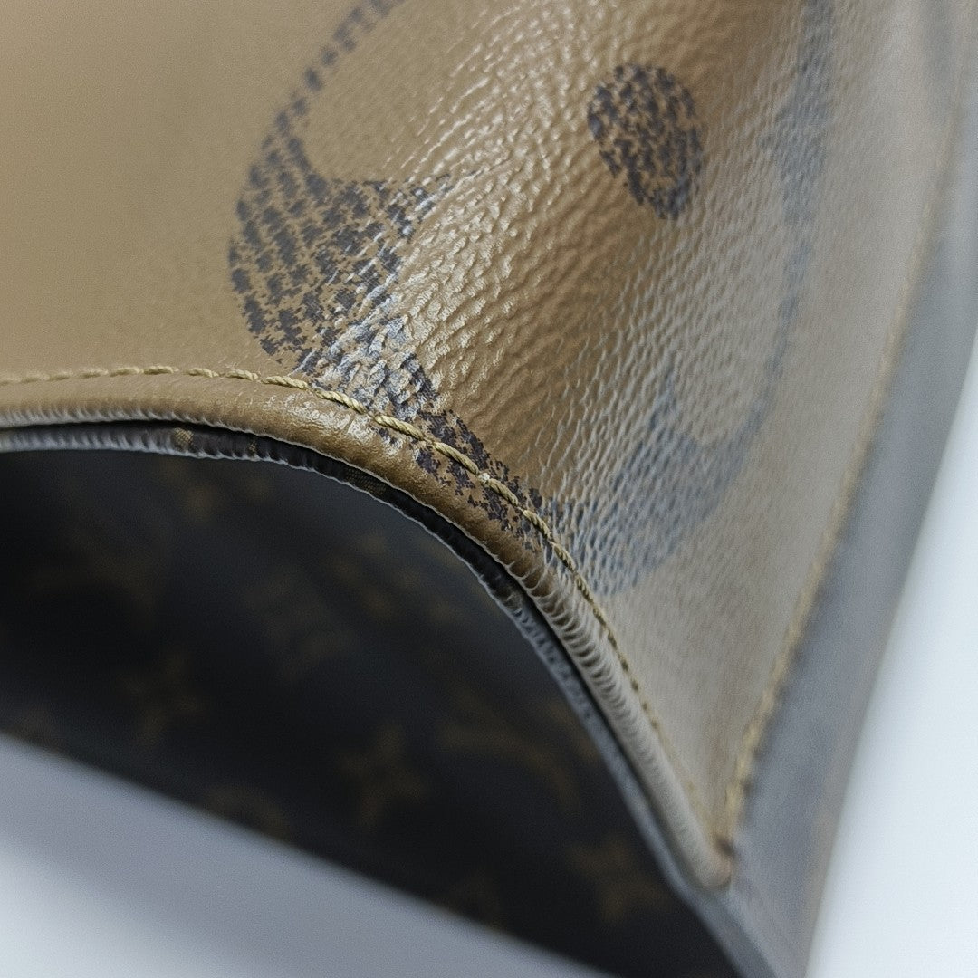 ONTHEGO MM Monogram Coated Canvas Brown