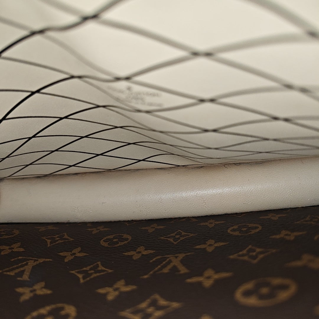 TRUNK Monogram Coated Canvas Brown
