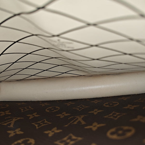 TRUNK Monogram Coated Canvas Brown