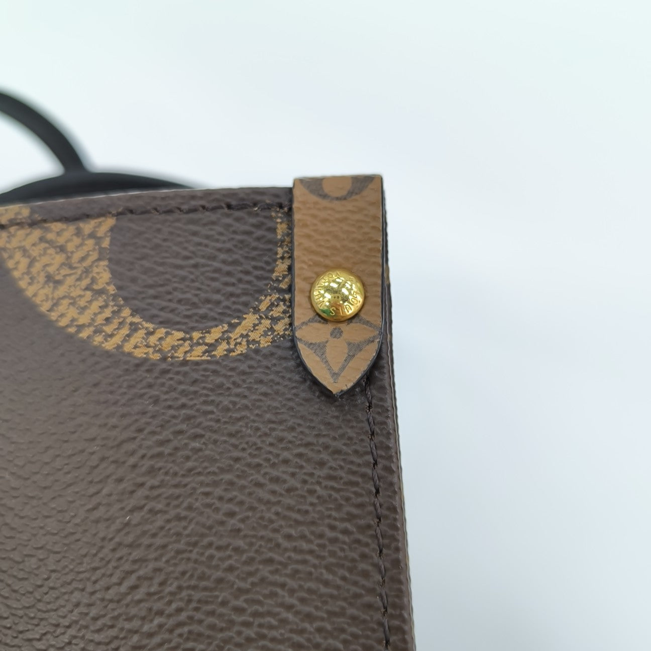 ONTHEGO MM Monogram Coated Canvas Brown