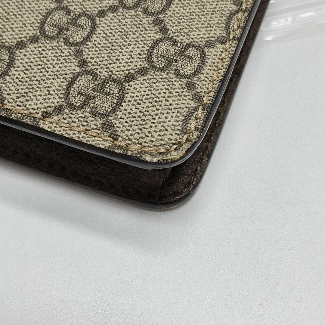 Monogram Coated Canvas Clutch Beige