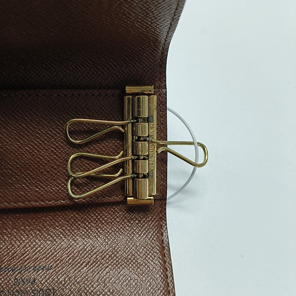 Monogram Coated Canvas Clutch Brown