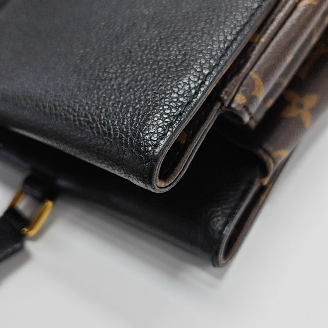 VÉNUS Monogram Coated Canvas Brown