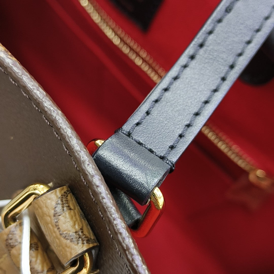 ONTHEGO MM Monogram Coated Canvas Brown