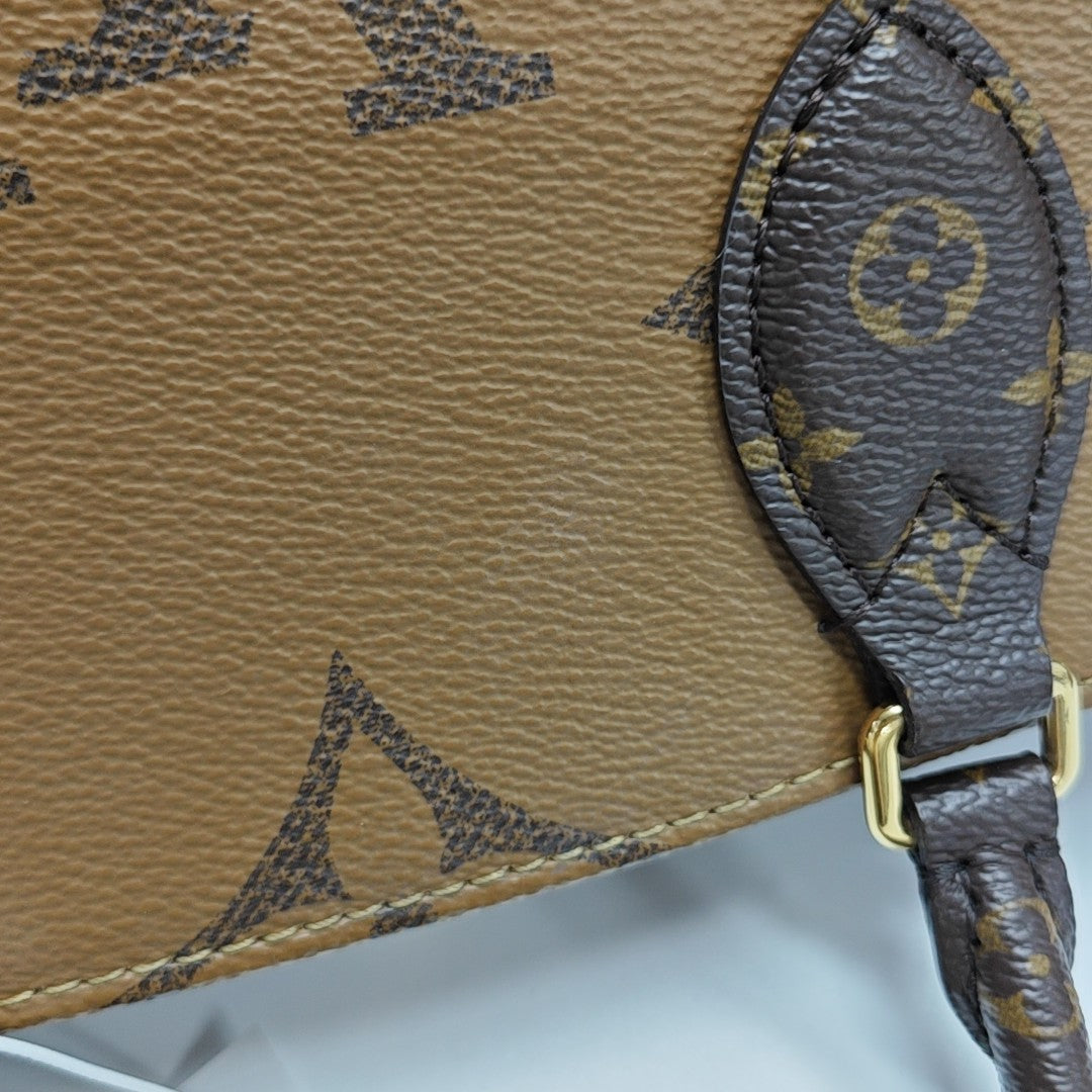 ONTHEGO PM Monogram Coated Canvas Brown