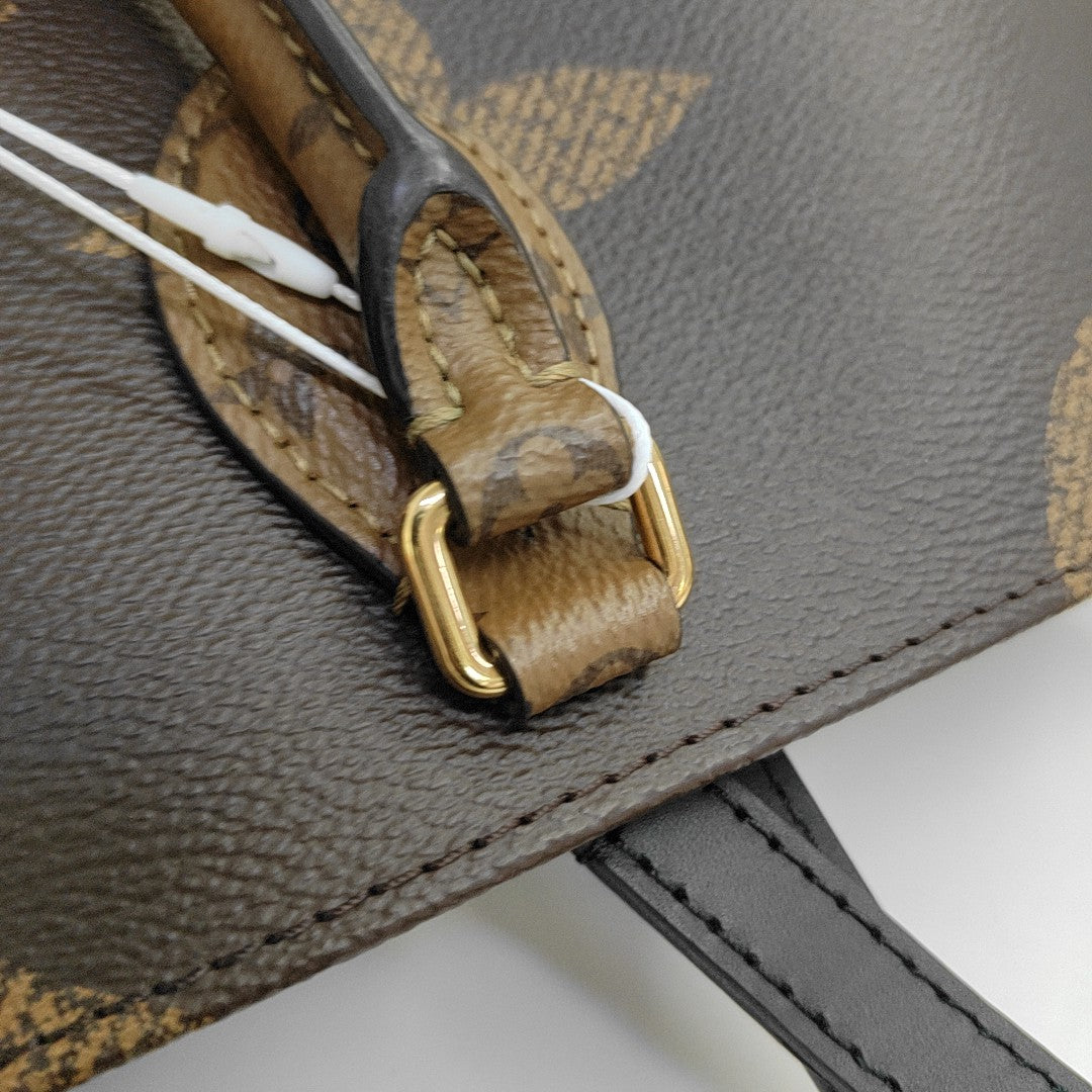 ONTHEGO MM Monogram Coated Canvas Brown