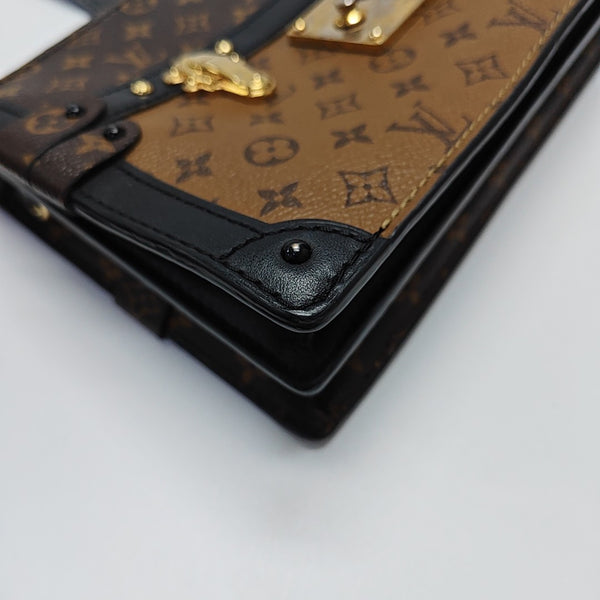 TRUNK Monogram Coated Canvas Brown