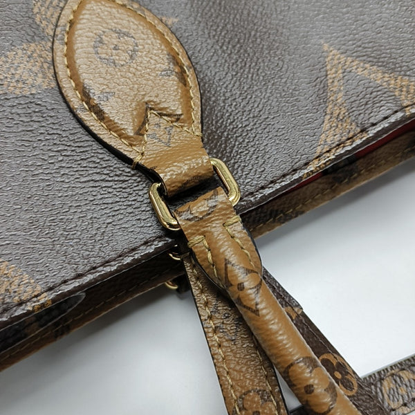 ONTHEGO MM Monogram Coated Canvas Brown