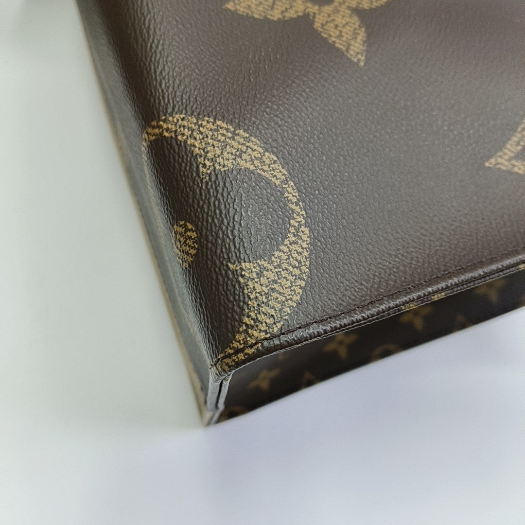 ONTHEGO MM Monogram Coated Canvas Brown